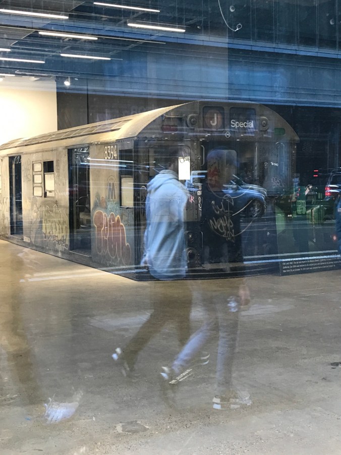 Suddenly Mad- a graffitied subway car relic inside a window