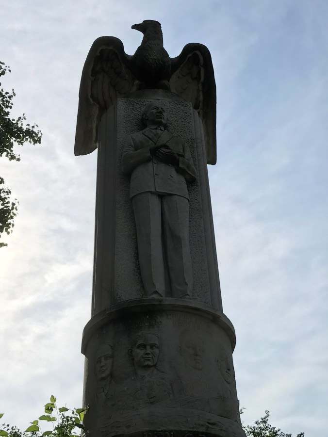 Suddenly Mad- Flummoxed (Marconi with eagle sculpture Church Square Park)